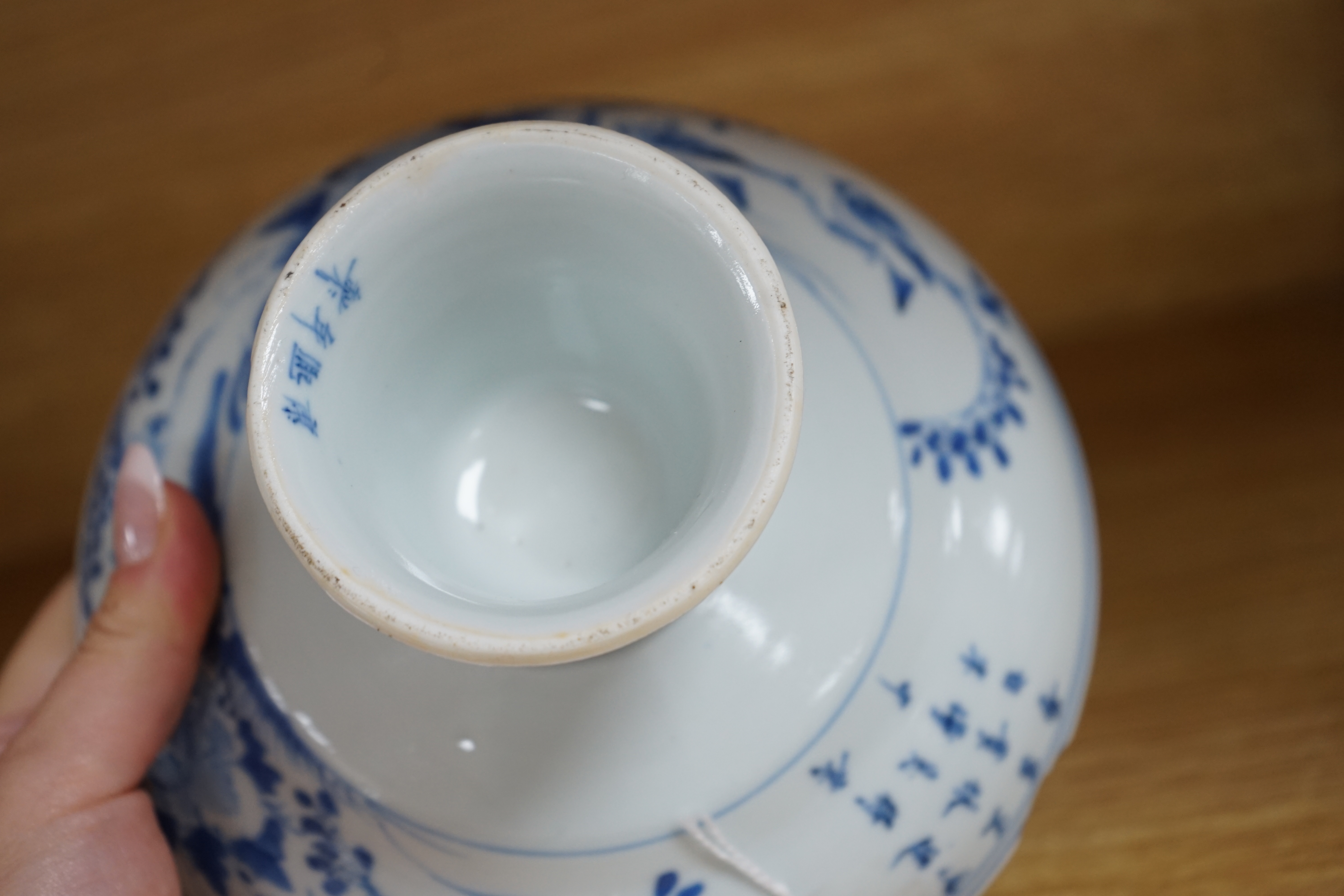 A Chinese blue and white stem dish, Kangxi mark, c.1900. Condition - poor to fair, some significant chipping to rim